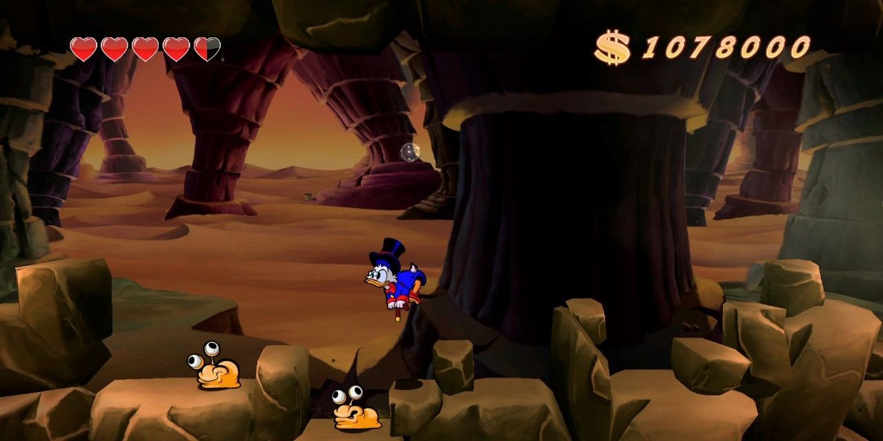 Scrooge bounces on rocks in DuckTales: Remastered